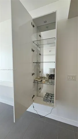 a view of a living room and kitchen