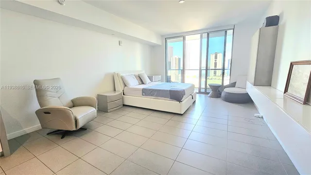 a view of swimming pool with outdoor seating and plants