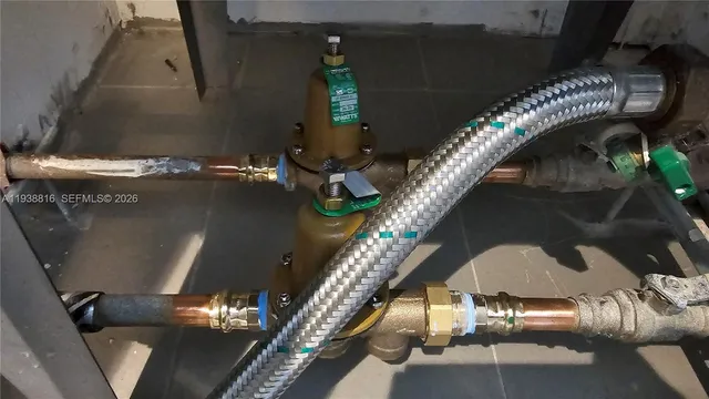 a view of a swimming pool with outdoor seating and city view