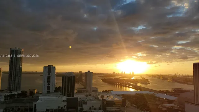 a kitchen with stainless steel appliances granite countertop a refrigerator sink and stove