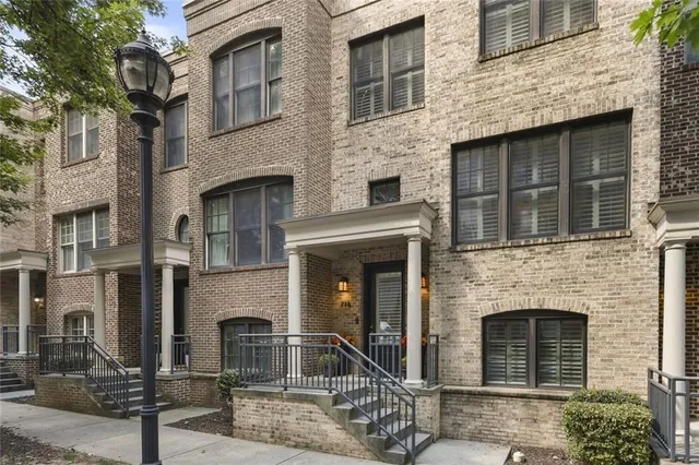 a view of staircase with white walls and windows
