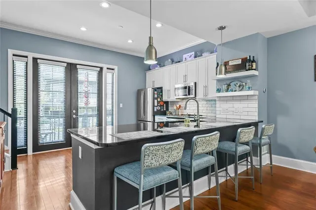 a room with furniture pool table and flat screen tv