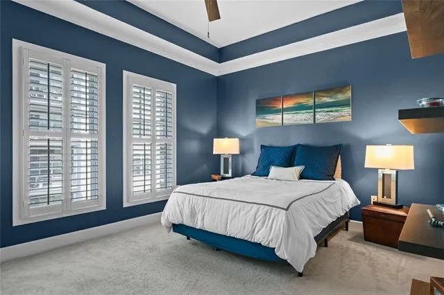 a bedroom with a bed and a lamp on table