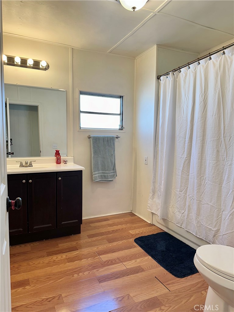 5800 Hamner Avenue, Unit 53 Eastvale, CA 91752 - Photo 11 of 19 a bathroom with a sink and a mirror