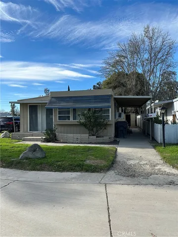 a view of a house with a yard and plants
