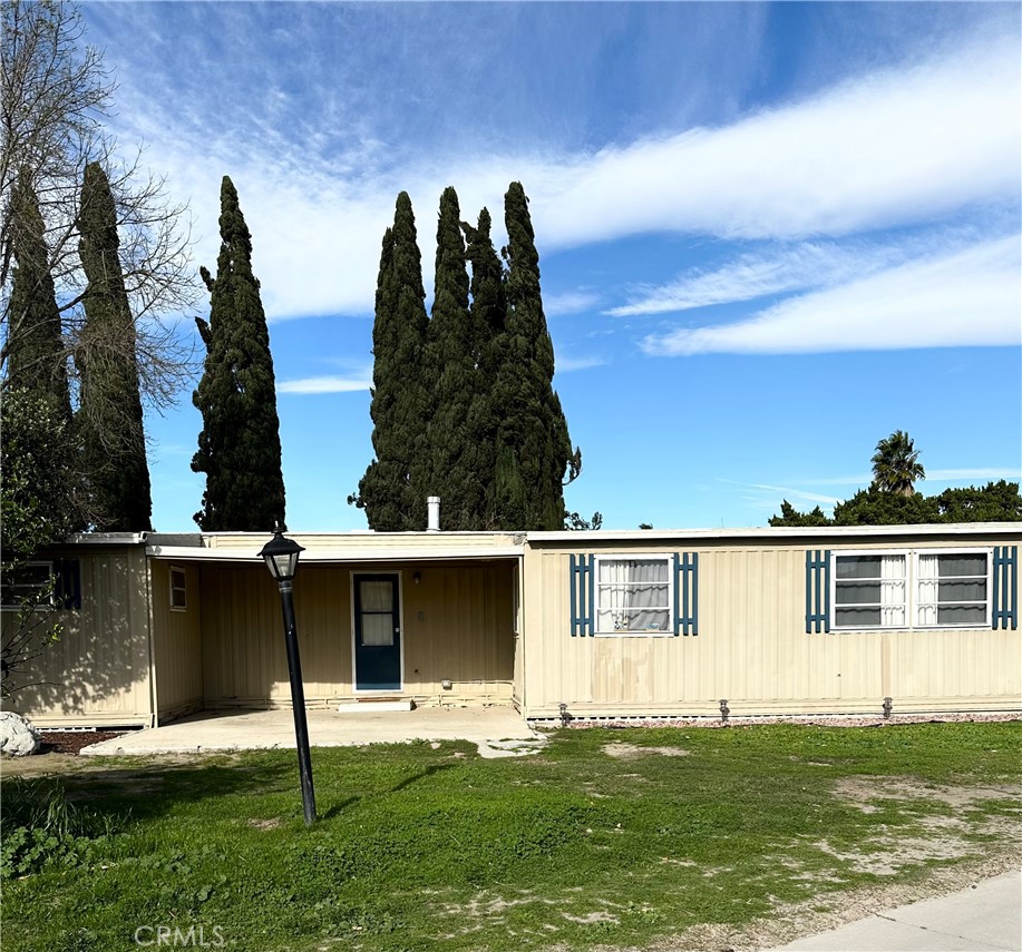 5800 Hamner Avenue, Unit 53 Eastvale, CA 91752 - Photo 2 of 19 a view of a house with a yard