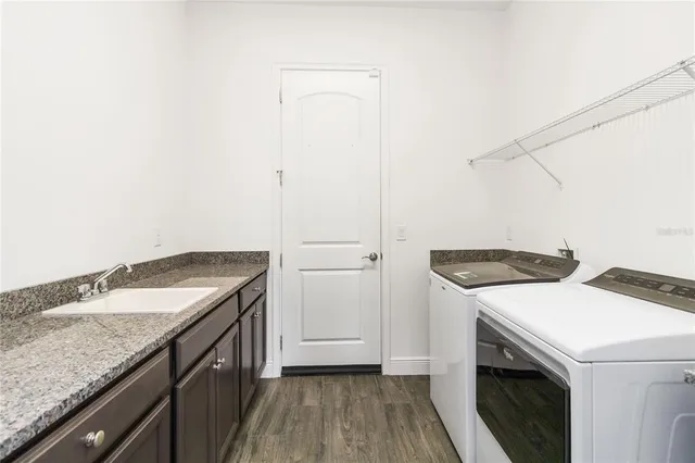 a utility room with washer and dryer