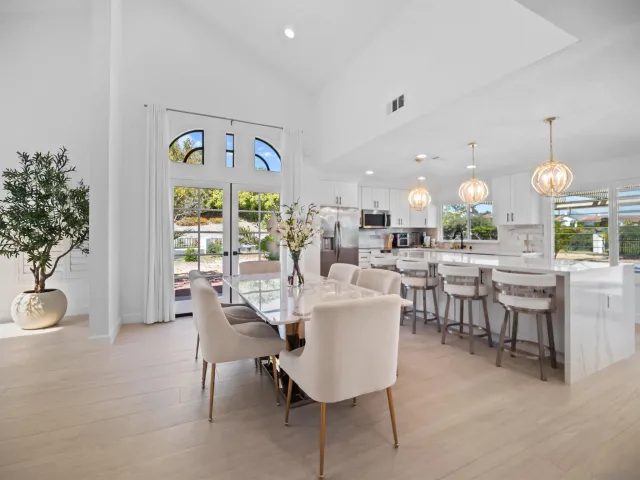 a bathroom with a double vanity sink mirror and toilet