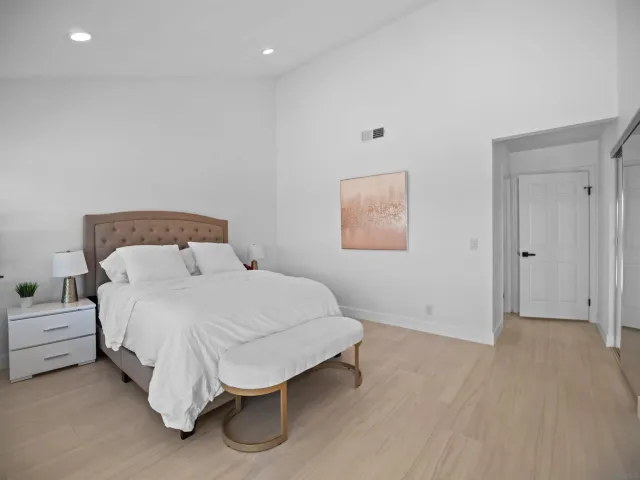a view of a patio with table and chairs and potted plants