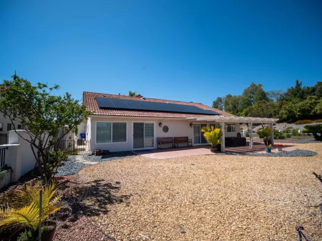 a view of a backyard of the house
