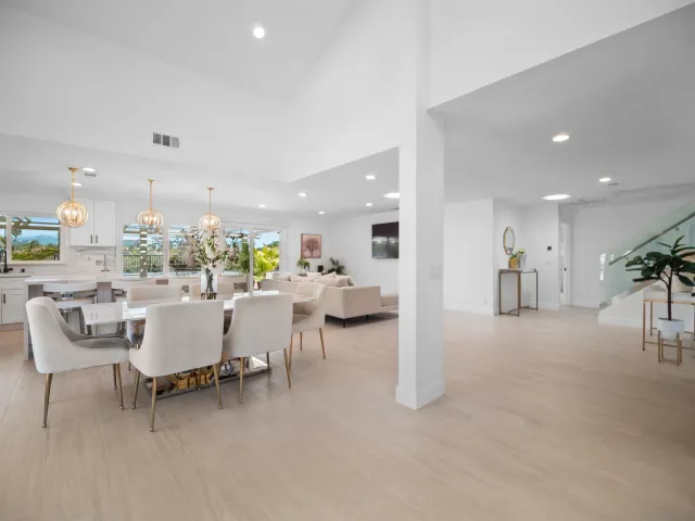 a view of a living room kitchen and a large window