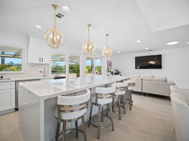 a kitchen with a dining table and chairs