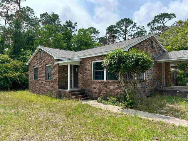 front view of a house with a yard