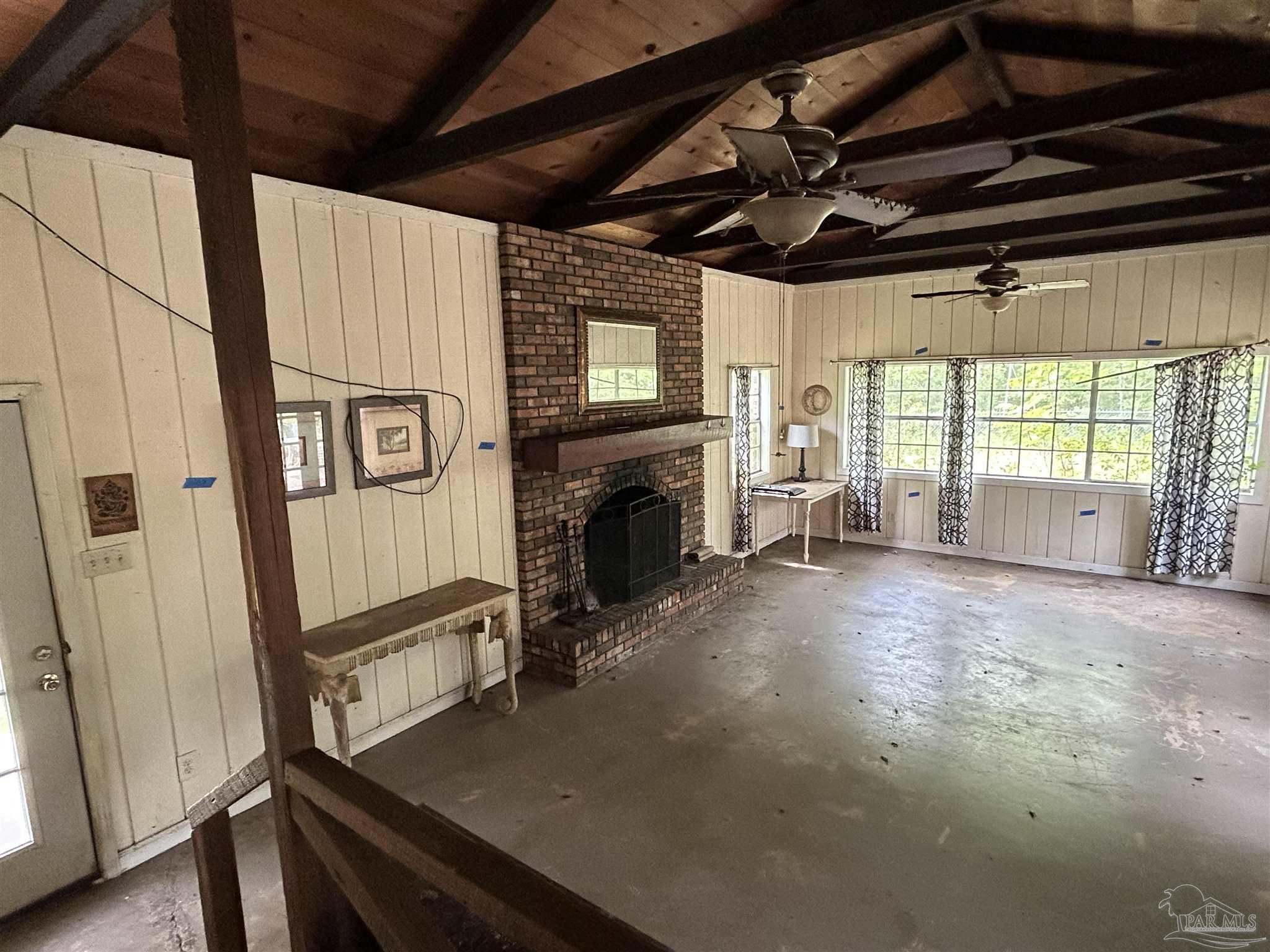 9880 N Loop Pensacola, FL 32507 - Photo 6 of 13 a view of an empty room with a fireplace