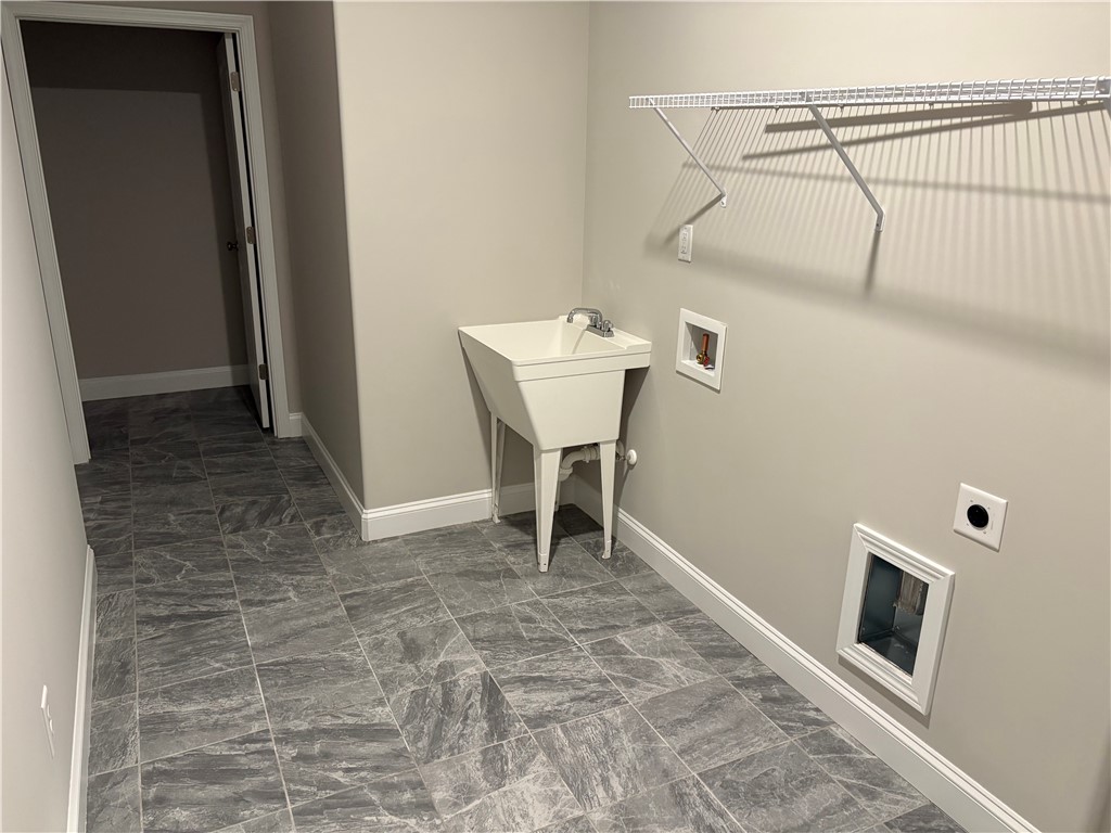 240 Meridian Way Seneca, SC 29672 - Photo 15 of 19 Functional utility room with durable tiled floors and practical washbasin.