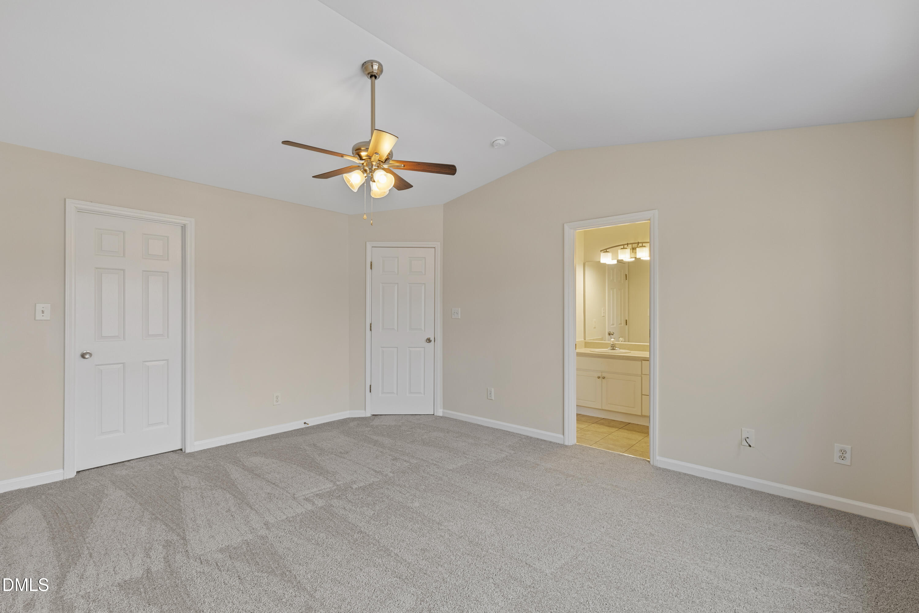 6013 San Marcos Way Raleigh, NC 27616 - Photo 13 of 21 an empty room with a chandelier fan and closet