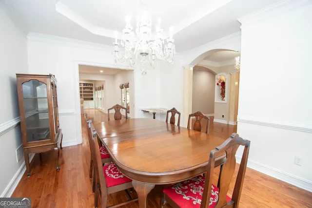 a kitchen with stainless steel appliances granite countertop a sink and a refrigerator