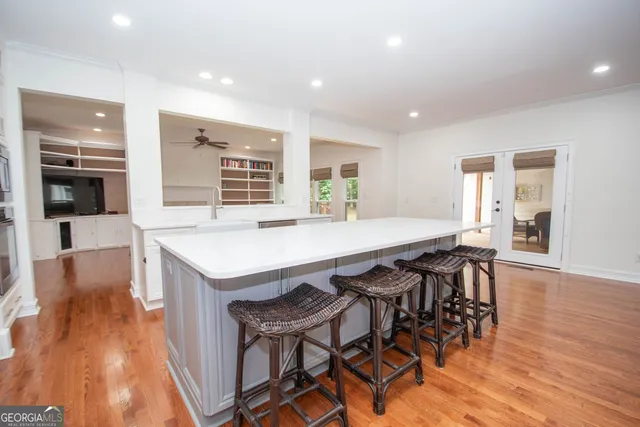 a kitchen with stainless steel appliances a refrigerator sink and cabinets