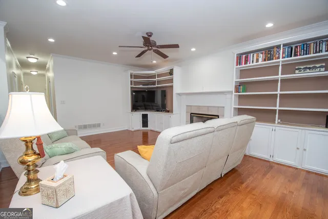 a bathroom with a tub shower and mirror