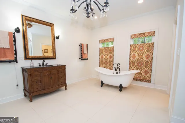 a kitchen with a wooden floor and cabinets
