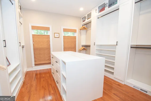 a white bath tub sitting next to a white toilet