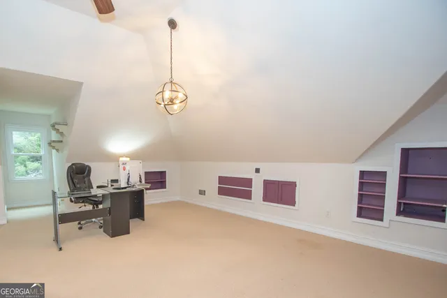 a view of a backyard with sitting area