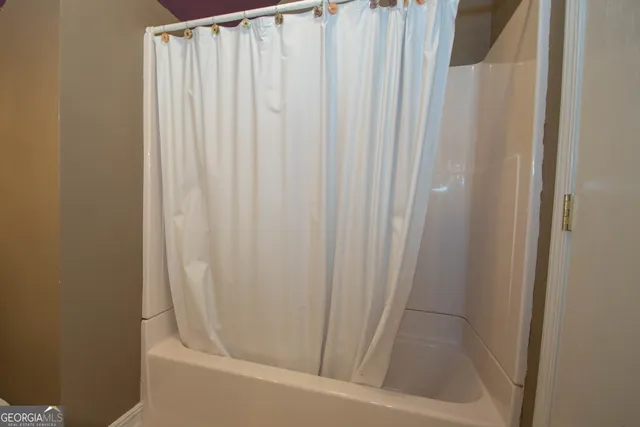 a front view of a house with yard and green space