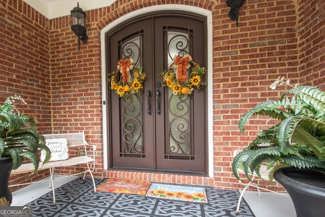 a front view of a house with outdoor seating