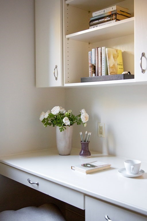 122 Clark Road Brookline, MA 02445 - Photo 26 of 40 a view of a vase of flowers sitting on a dining table
