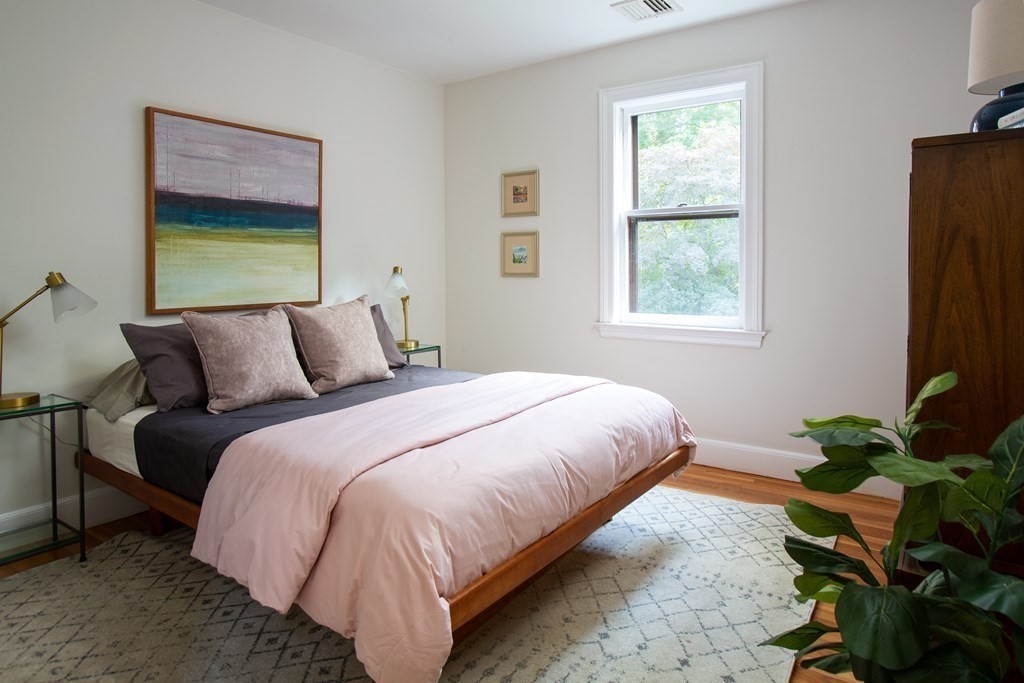 122 Clark Road Brookline, MA 02445 - Photo 29 of 40 a bedroom with bed and a window