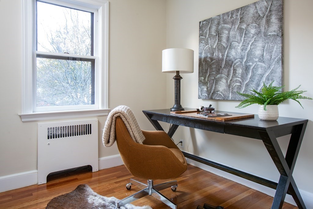 122 Clark Road Brookline, MA 02445 - Photo 31 of 40 a view of a workspace with furniture and a window