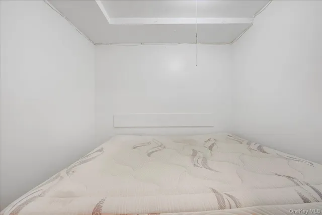a view of a livingroom with wooden floor and cabinets