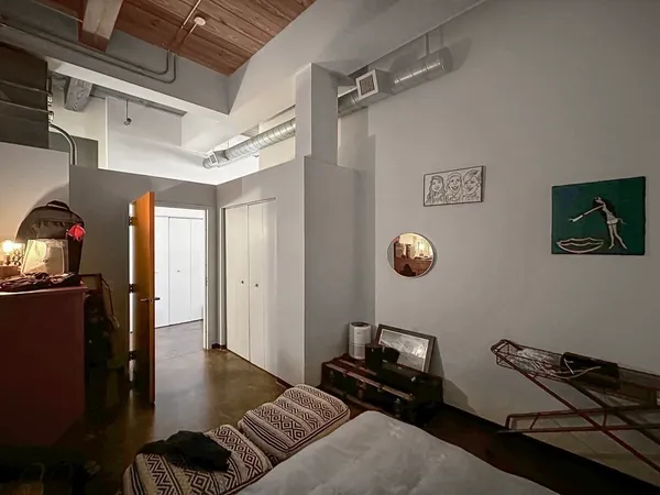 a view of a livingroom with furniture and windows