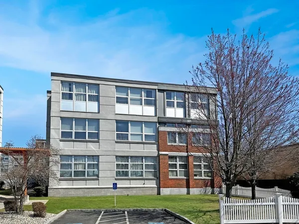a view of a building with a yard