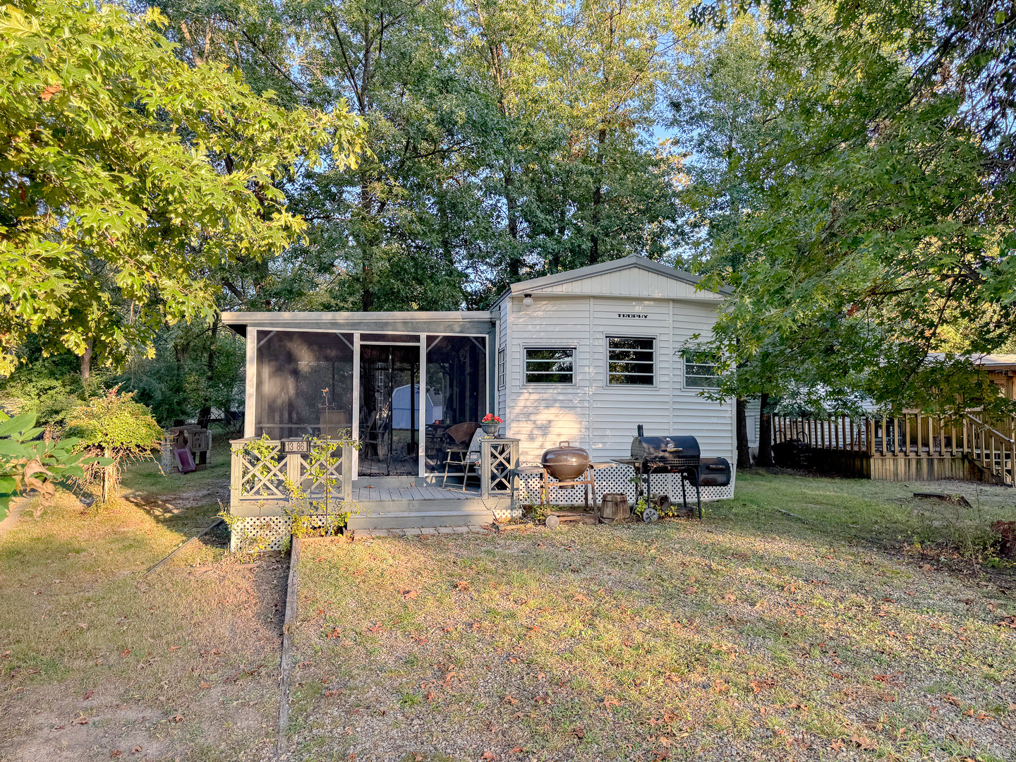 a view of a house with backyard porch and sitting area