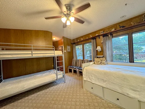 a bedroom with a bed and a table