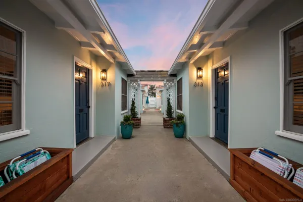 a view of hallway with livingroom and furniture