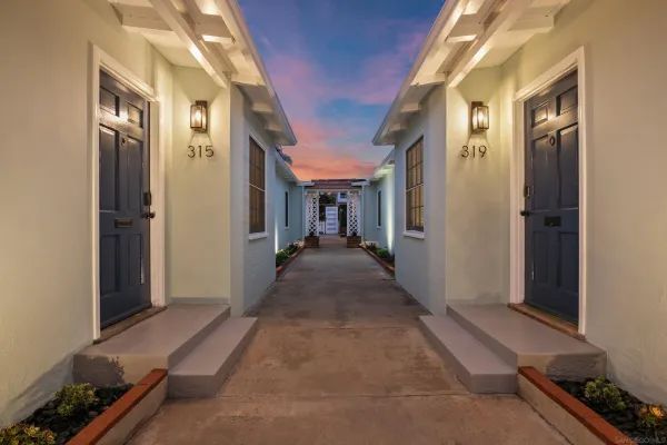 a view of hallway with living room and furniture