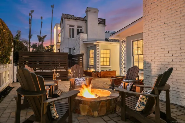a view of a patio with table and chairs