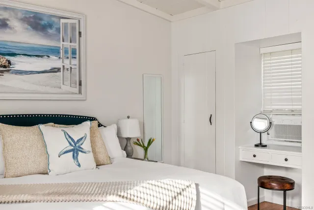 a bedroom with a bed and window