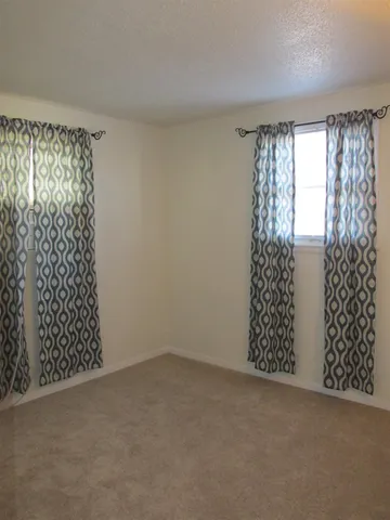 en view of an empty room with a window