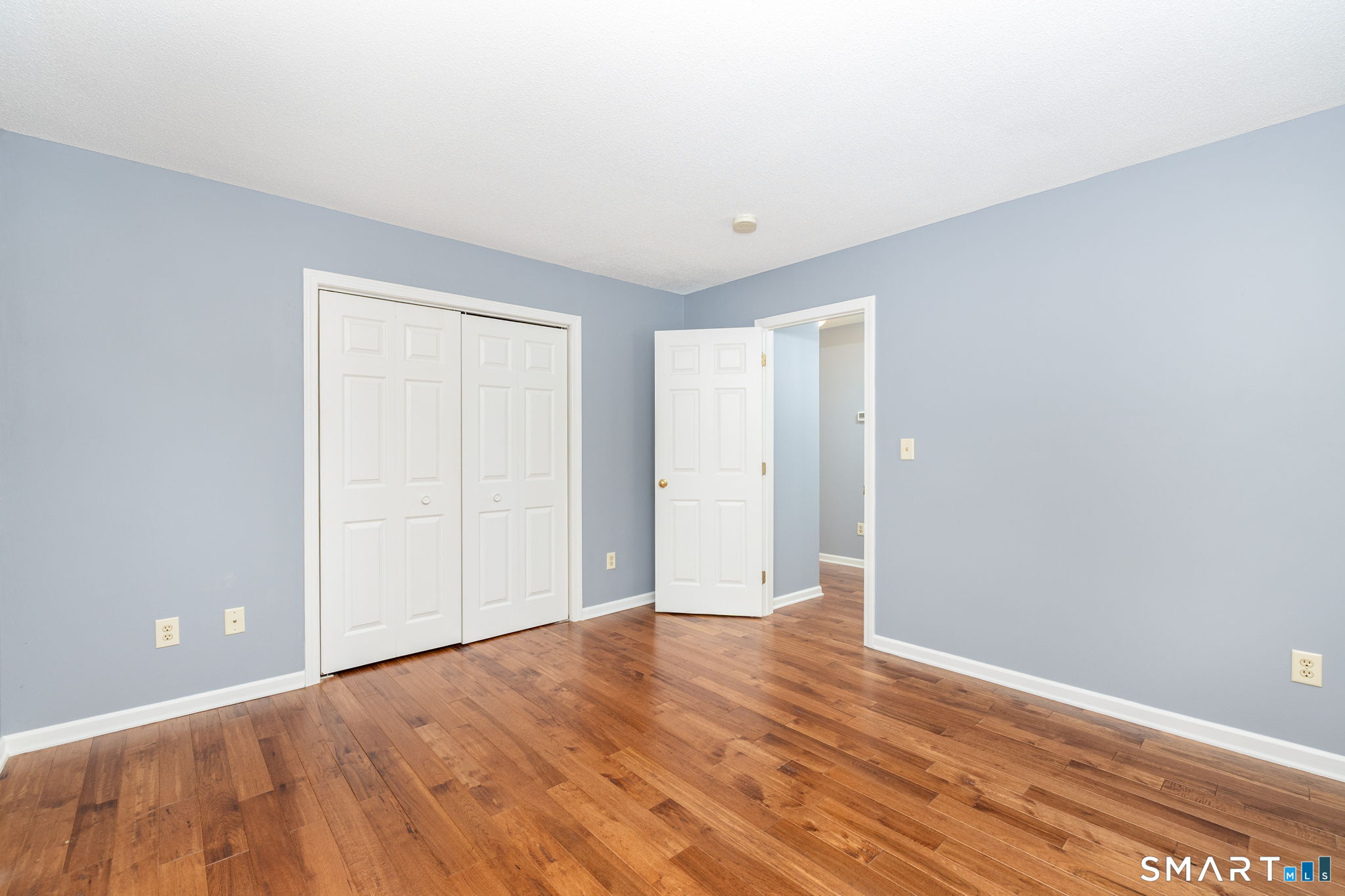 175 Vernon Street Manchester, CT 06042 - Photo 15 of 38 a view of an empty room with wooden floor