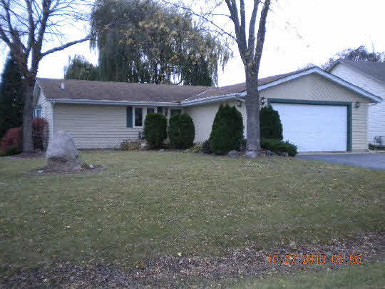 247 Rochester Road Northeast Poplar Grove, IL 61065 - Photo 1 of 7 a view of a house with a tree and a yard