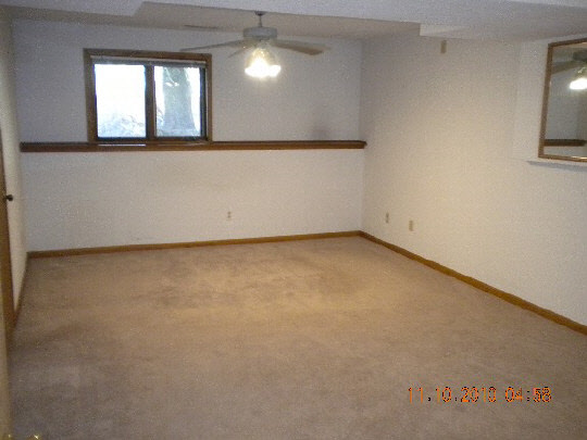 247 Rochester Road Northeast Poplar Grove, IL 61065 - Photo 7 of 7 an empty room with a window