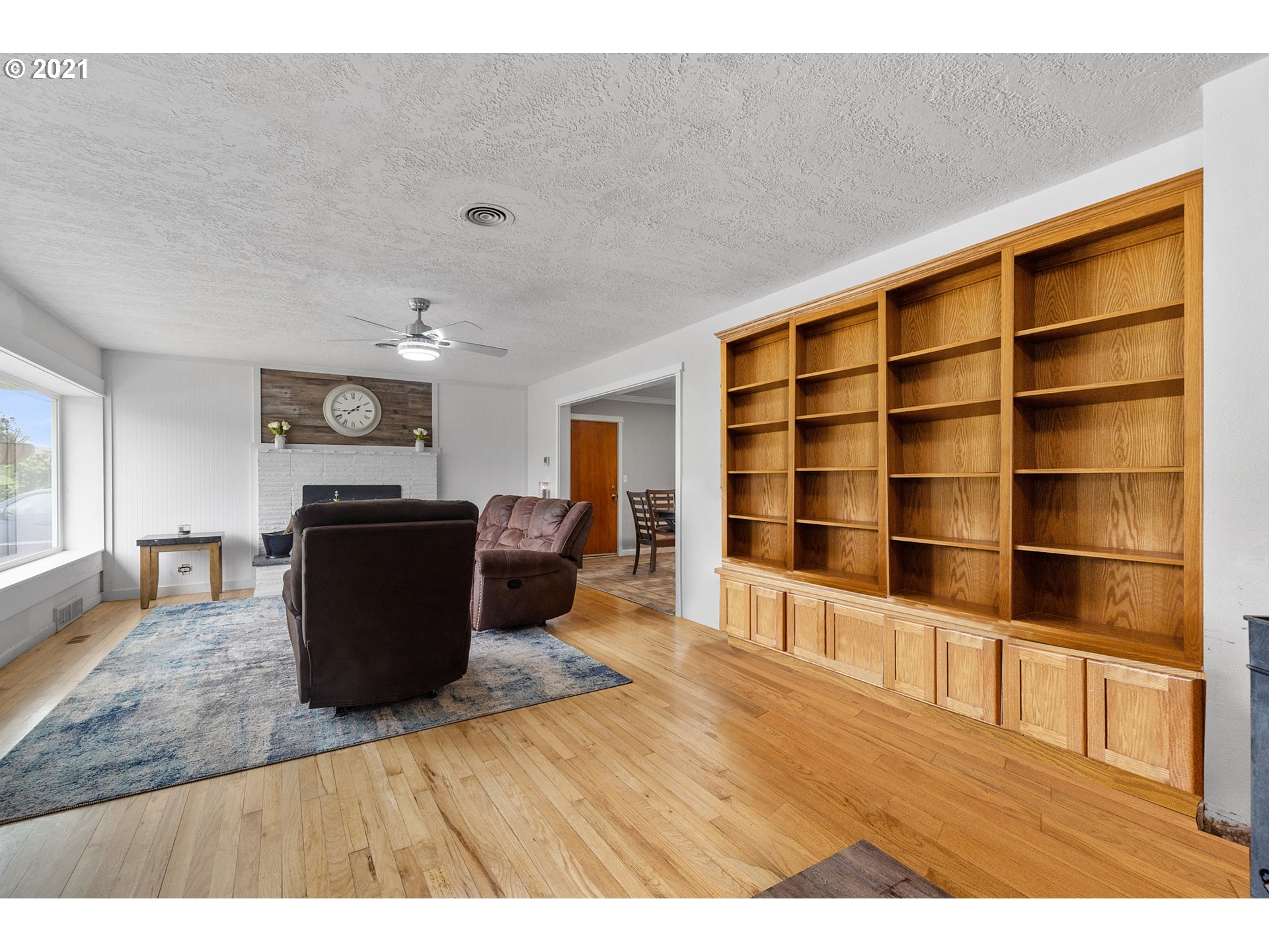1220 McCormick Loop Road Tillamook, OR 97141 - Photo 12 of 30 a living room with furniture a flat screen tv and a rug