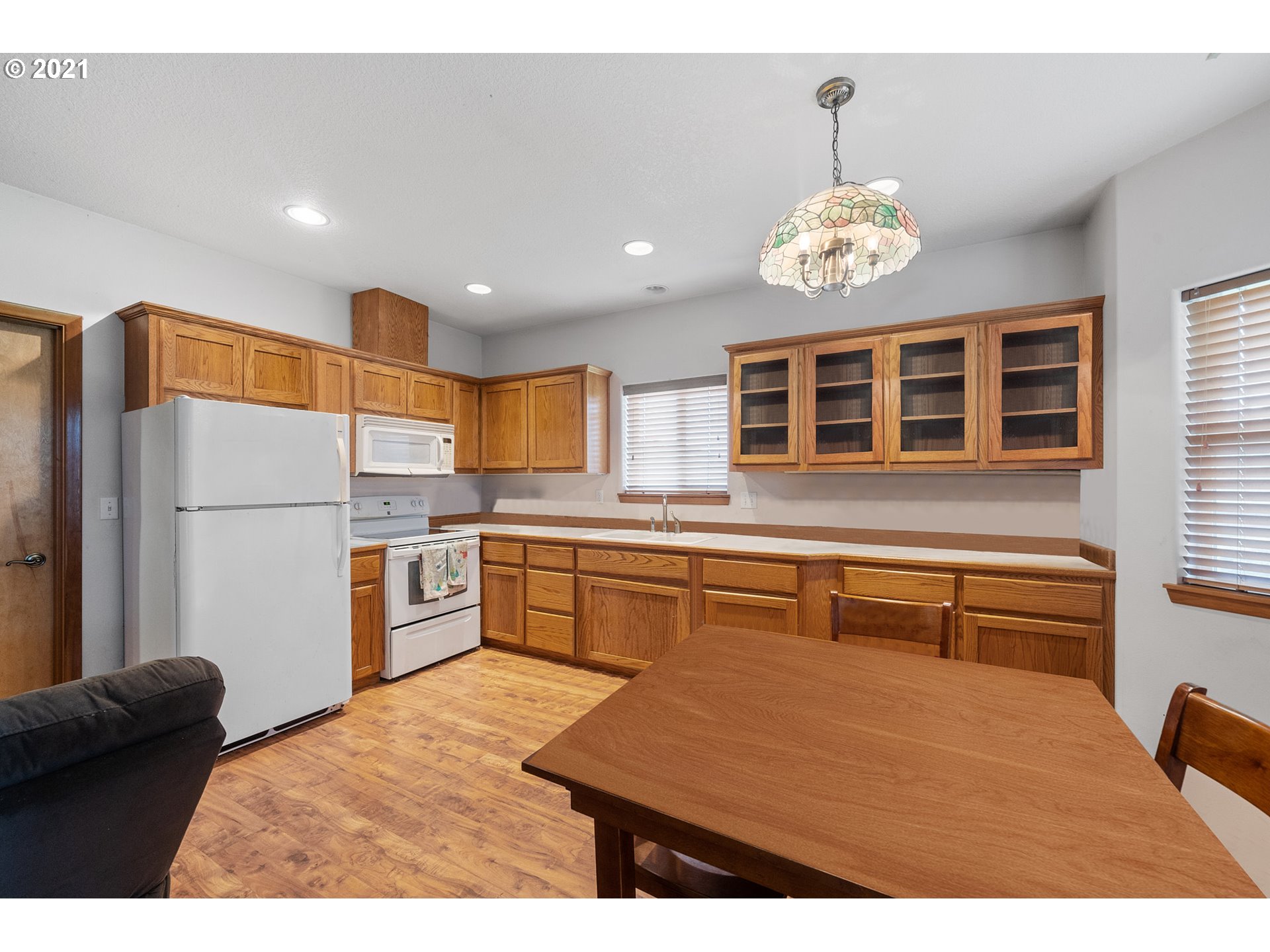 1220 McCormick Loop Road Tillamook, OR 97141 - Photo 18 of 30 a kitchen with a refrigerator and a sink