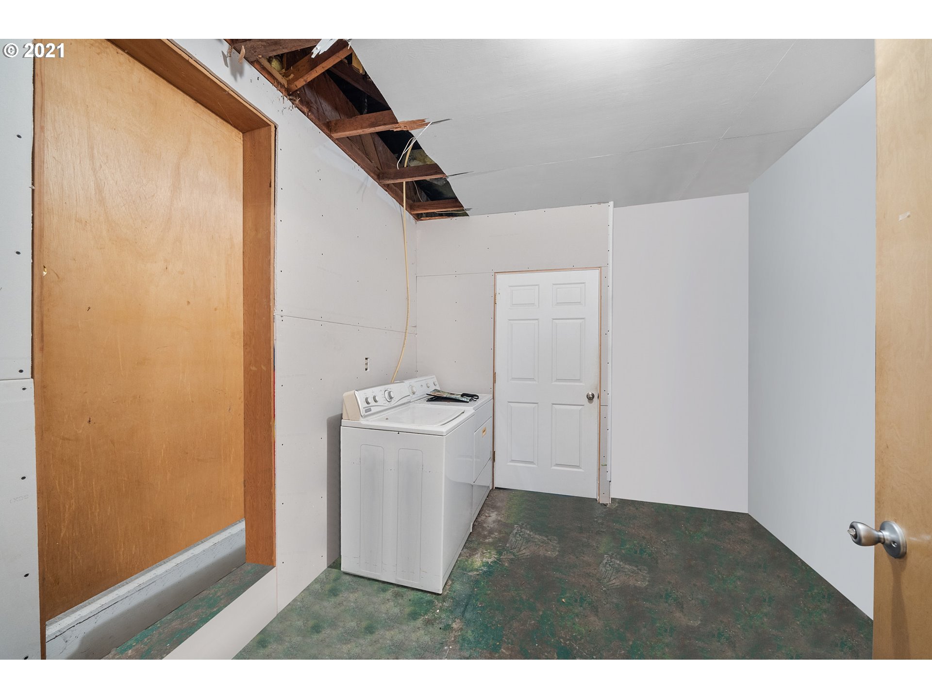 1220 McCormick Loop Road Tillamook, OR 97141 - Photo 19 of 30 a view of storage and utility room with washer and dryer