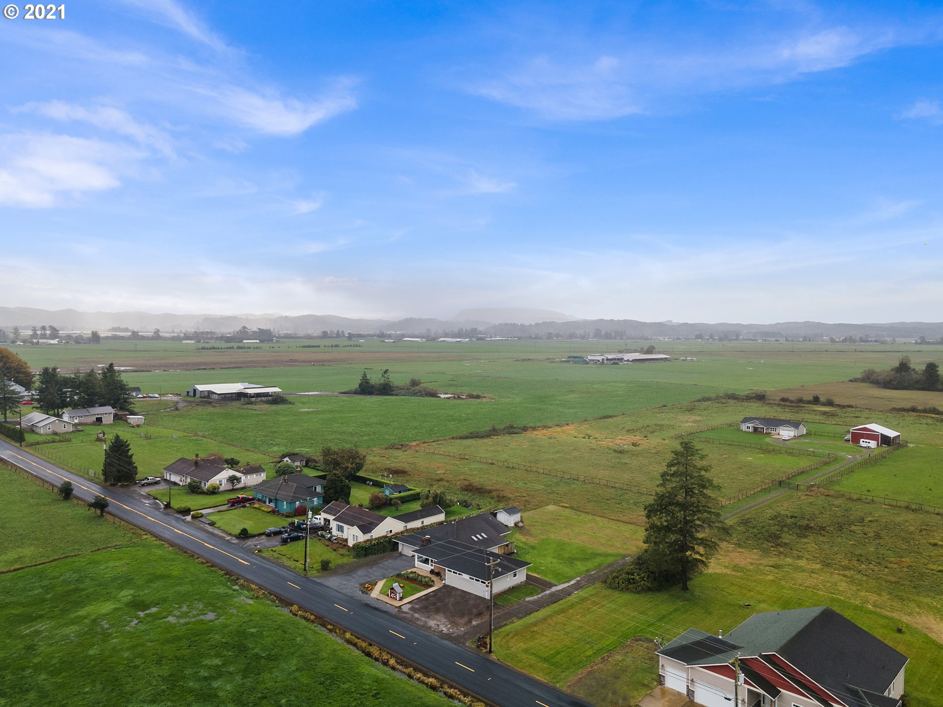 1220 McCormick Loop Road Tillamook, OR 97141 - Photo 2 of 30 a view of a lake with a mountain