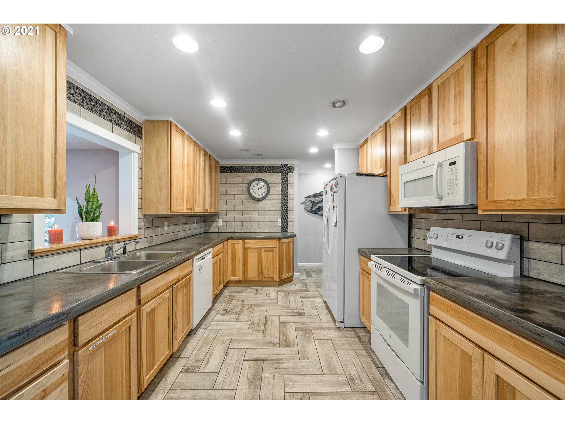 1220 McCormick Loop Road Tillamook, OR 97141 - Photo 21 of 30 a large kitchen with stainless steel appliances granite countertop a sink and cabinets