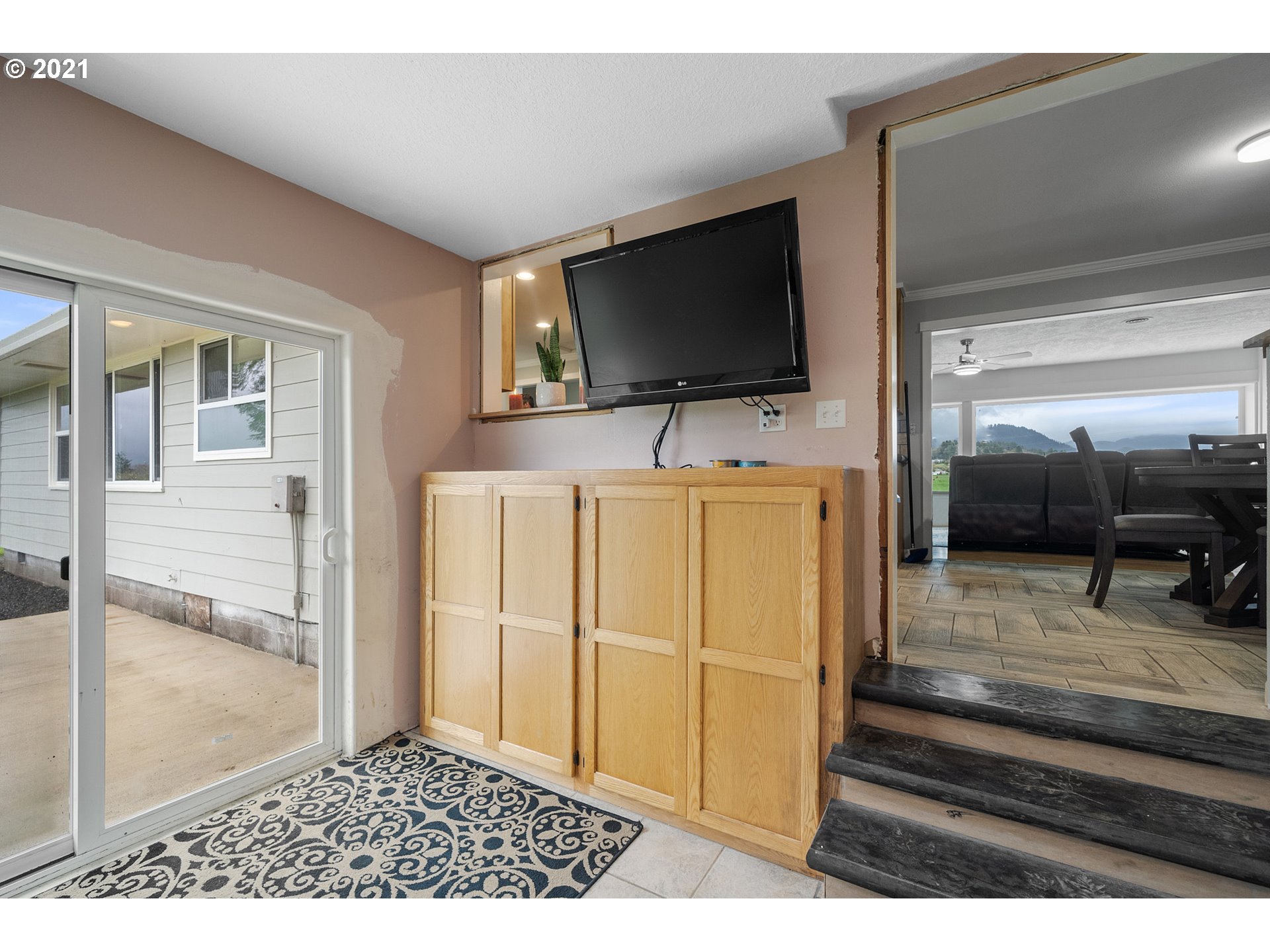 1220 McCormick Loop Road Tillamook, OR 97141 - Photo 23 of 30 a living room with furniture and a flat screen tv